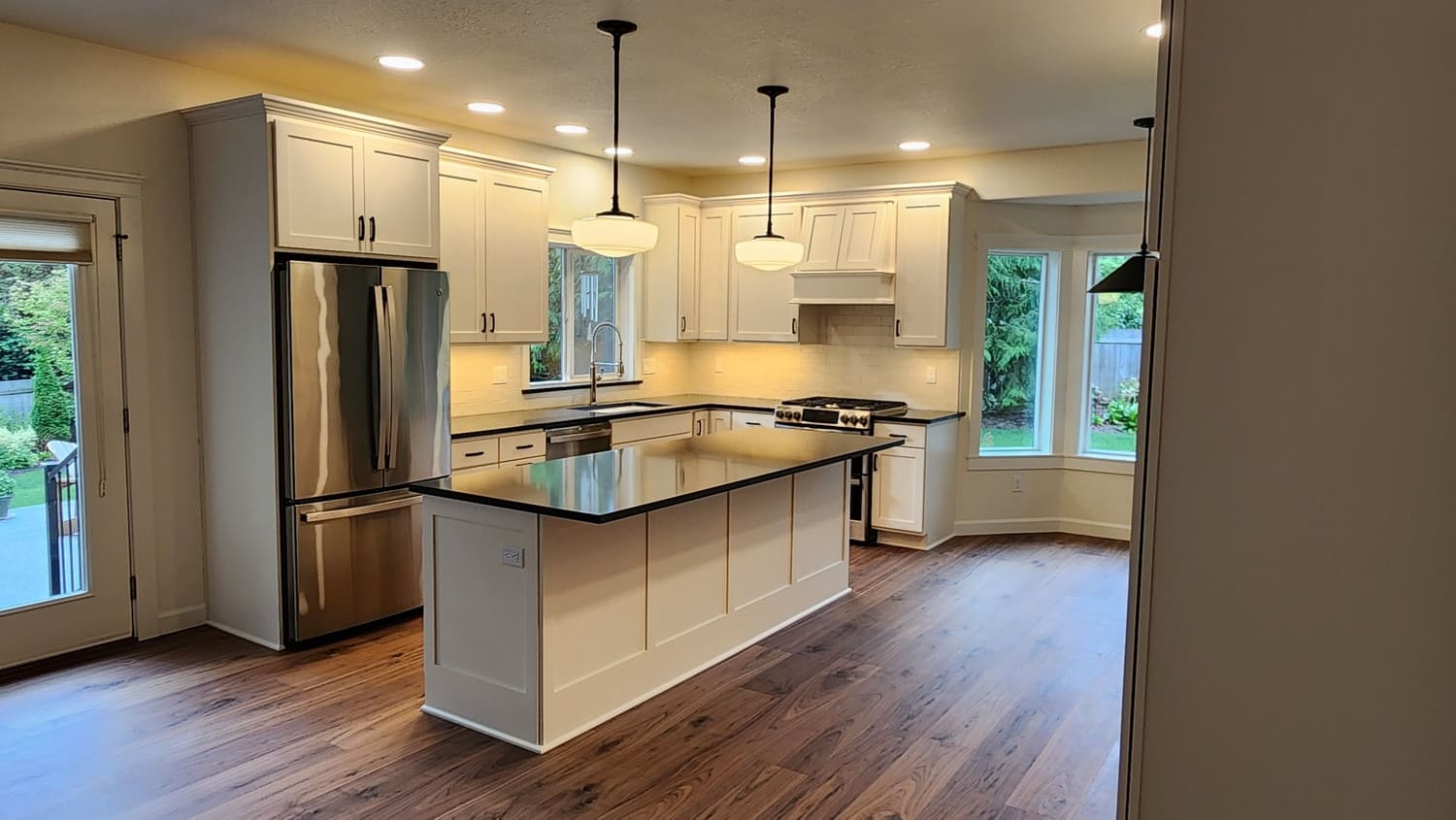 Sleek, modern white kitchen featuring clean lines, high-end appliances, and innovative storage solutions for a functional and stylish space.