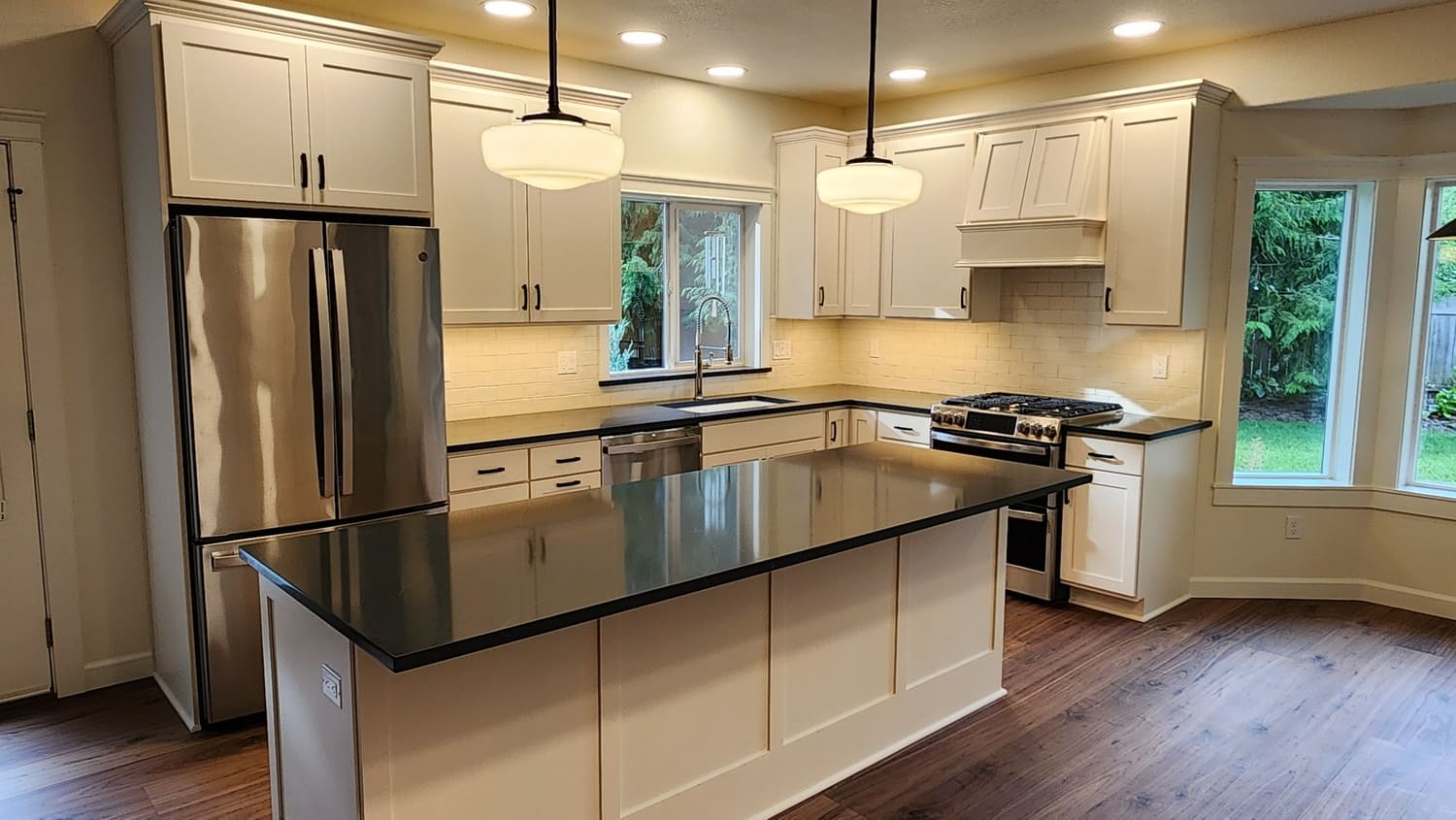 Sleek, modern white kitchen featuring clean lines, high-end appliances, and innovative storage solutions for a functional and stylish space.